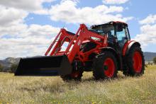 Red Kioti HX1301 or HX1401 tractor in a paddock